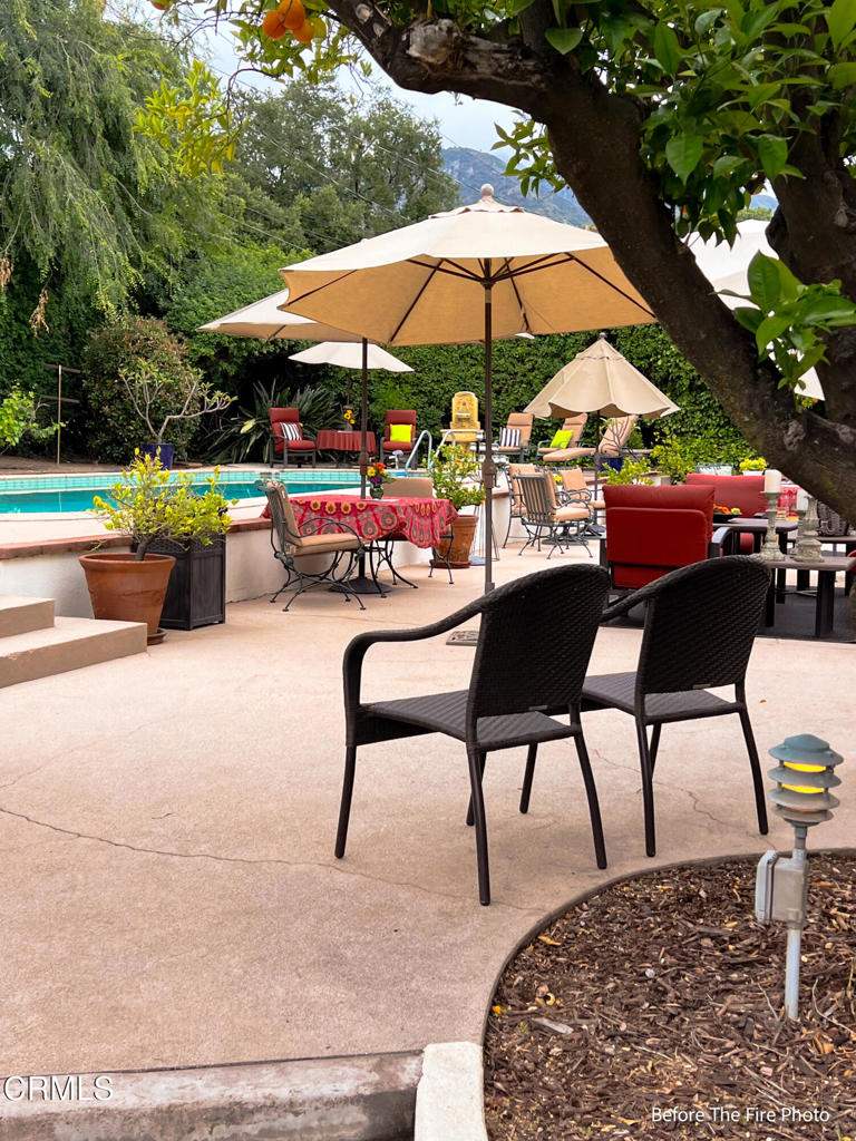 1625 Braeburn Road Altadena, CA 91001 - Photo 6 of 30 a view of a chairs and table in the back yard