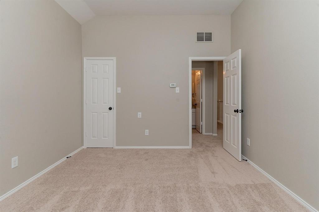 4313 Summer Star Lane Fort Worth, TX 76244 - Photo 22 of 26 Unfurnished bedroom featuring light carpet and vaulted ceiling