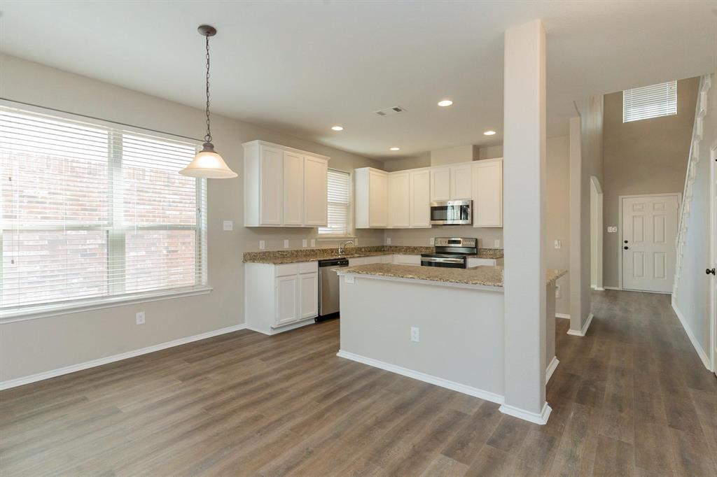 4313 Summer Star Lane Fort Worth, TX 76244 - Photo 9 of 26 Kitchen with appliances with stainless steel finishes, dark wood-style floors, white cabinetry, recessed lighting, and pendant lighting