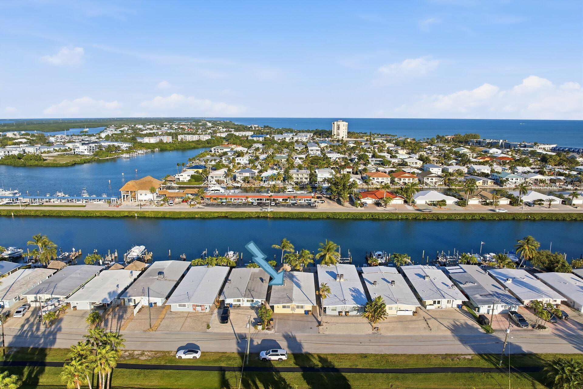 an aerial view of a house with a ocean view