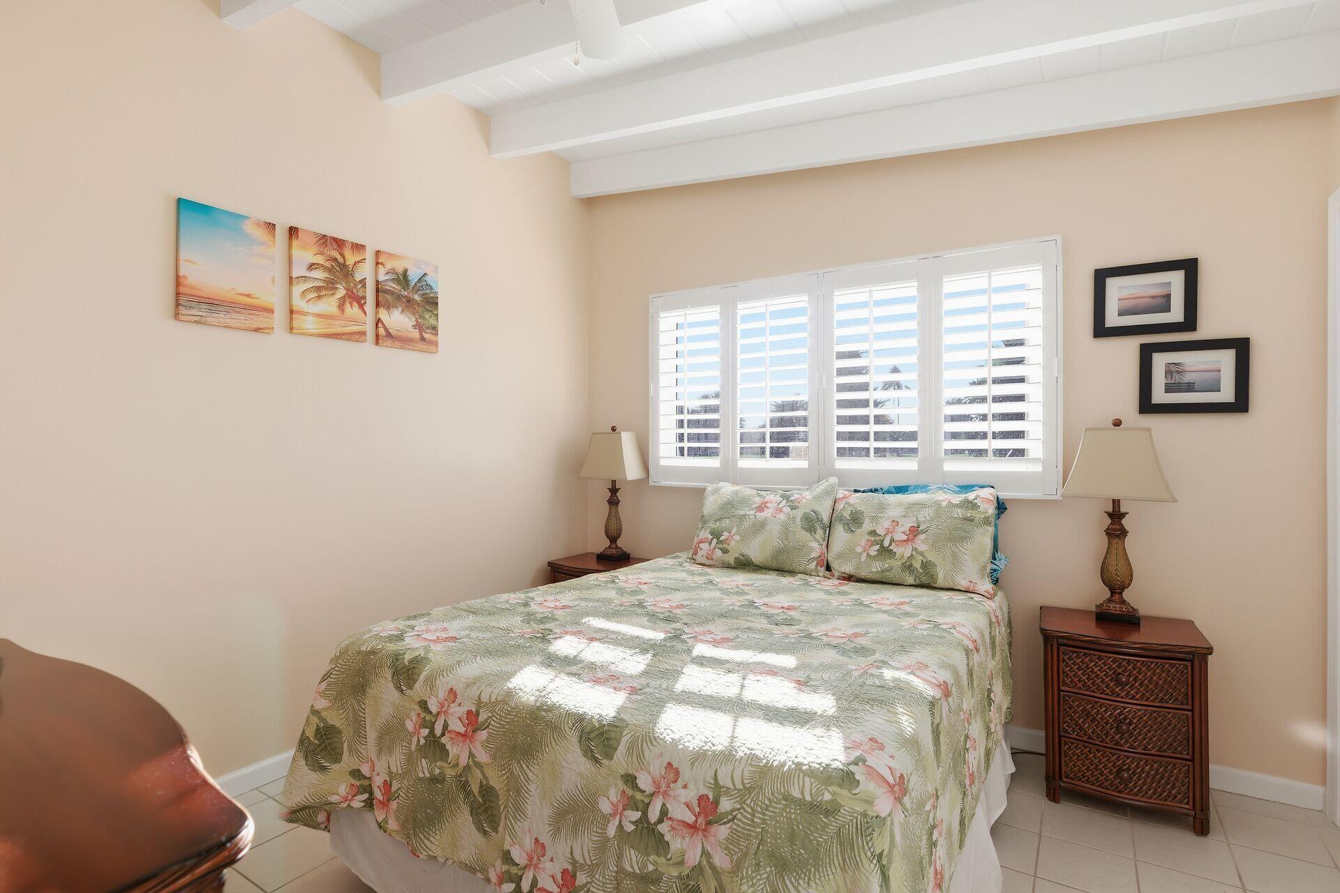 26 7th Street Key Colony Beach, FL 33051 - Photo 15 of 37 a bedroom with a bed and a couch
