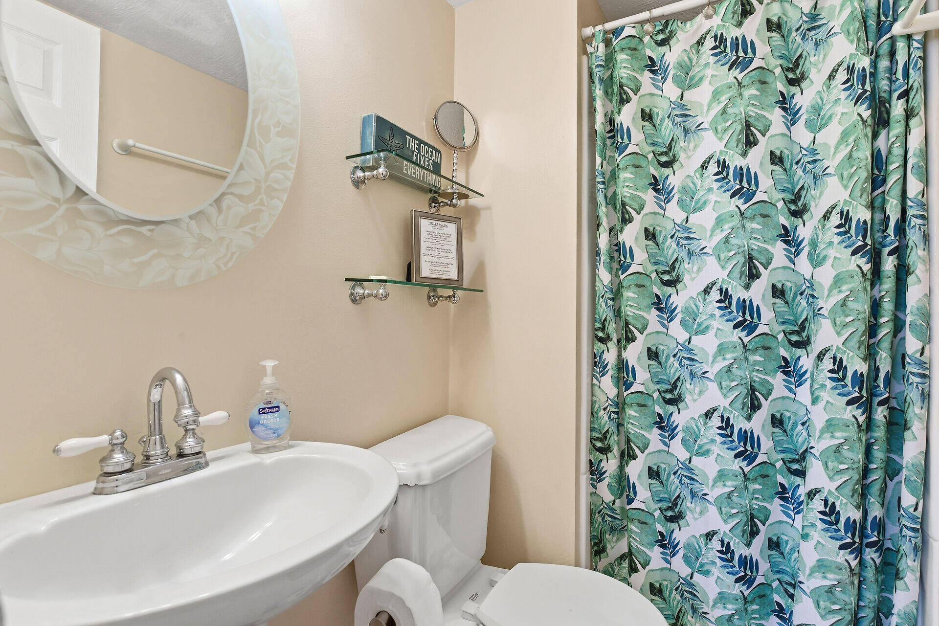 26 7th Street Key Colony Beach, FL 33051 - Photo 17 of 37 a bathroom with a sink a toilet and a mirror