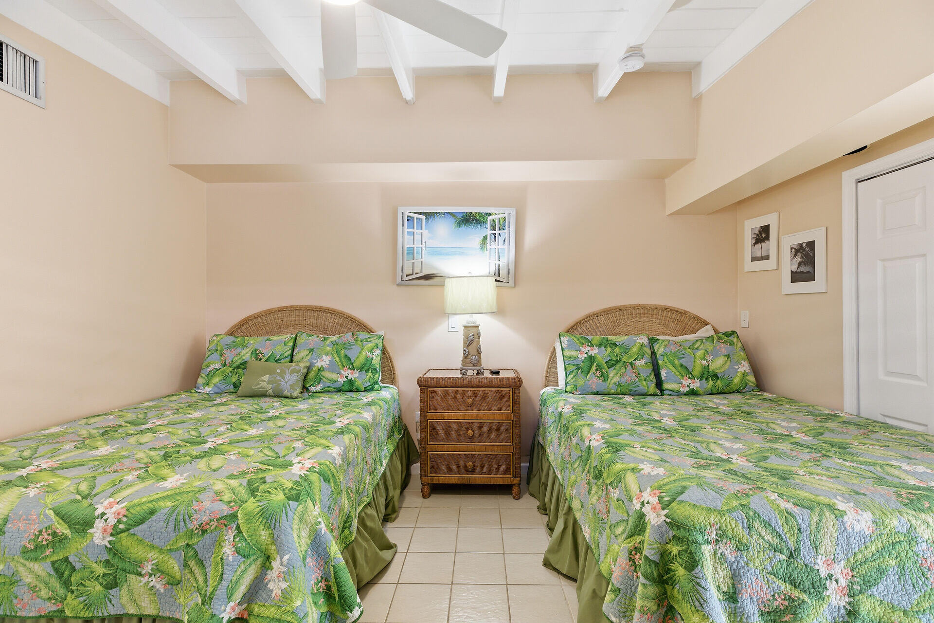 26 7th Street Key Colony Beach, FL 33051 - Photo 18 of 37 a bedroom with a bed and a painting on the wall