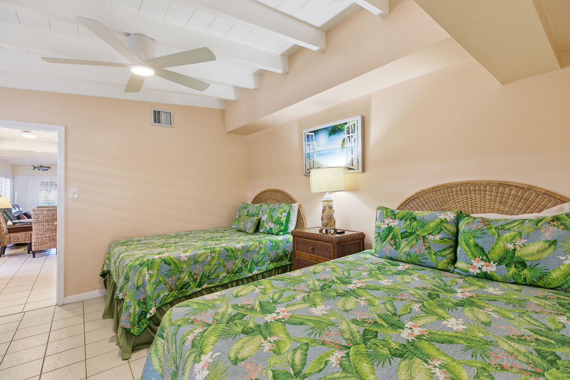 26 7th Street Key Colony Beach, FL 33051 - Photo 20 of 37 a bedroom with a bed and a table