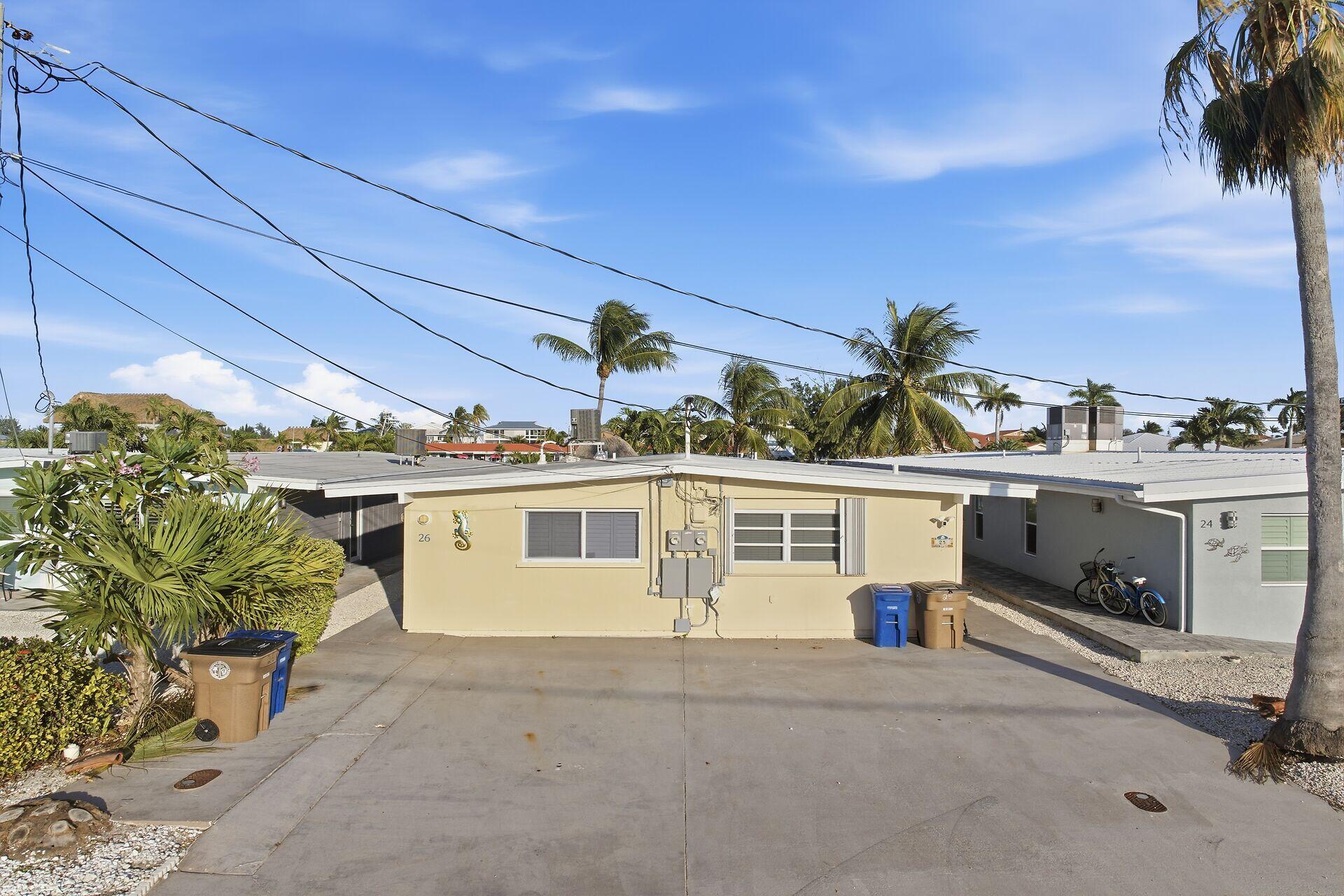 26 7th Street Key Colony Beach, FL 33051 - Photo 2 of 37 a view of a house with a yard