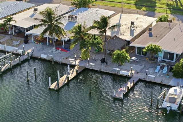 an aerial view of house with yard space swimming pool and outdoor seating