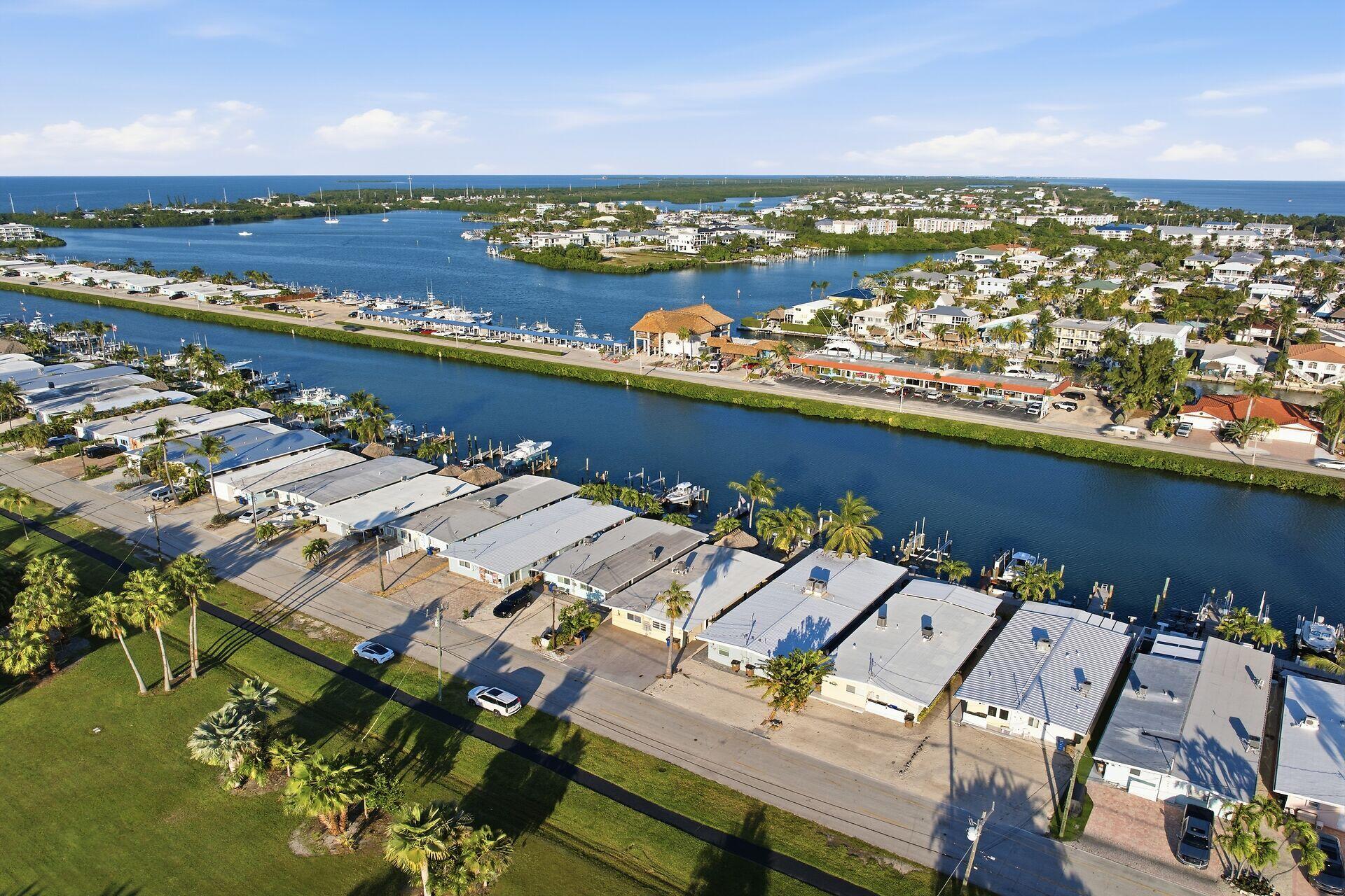26 7th Street Key Colony Beach, FL 33051 - Photo 3 of 37 an aerial view of a city with houses