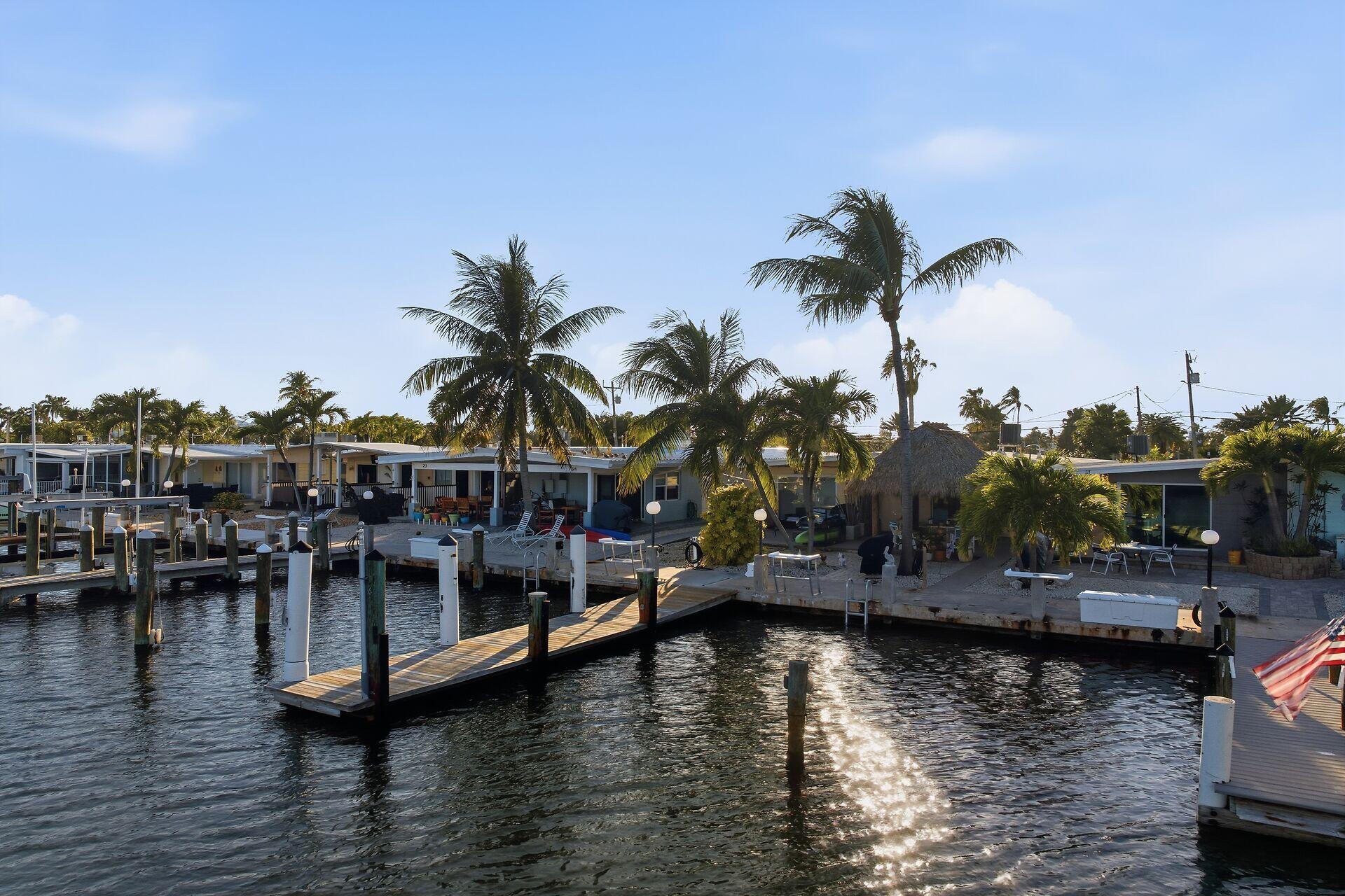 26 7th Street Key Colony Beach, FL 33051 - Photo 31 of 37 a view of water with boats and trees in the background
