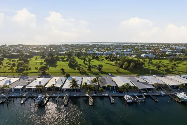 an aerial view of house with yard