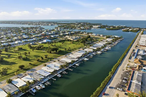 an aerial view of a city with a lake