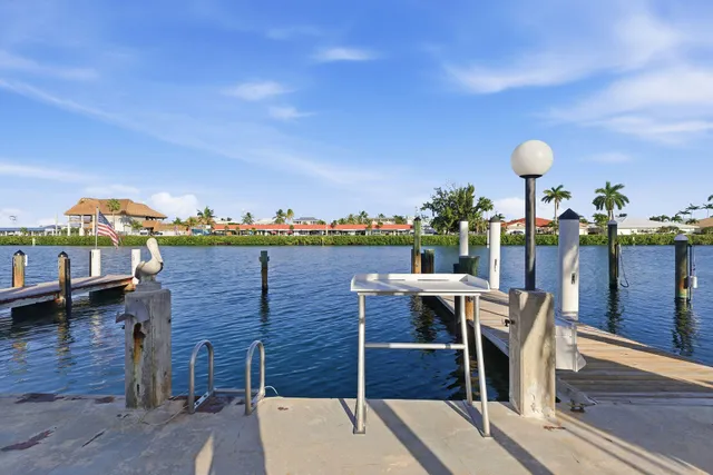 a view of a chairs and table in patio