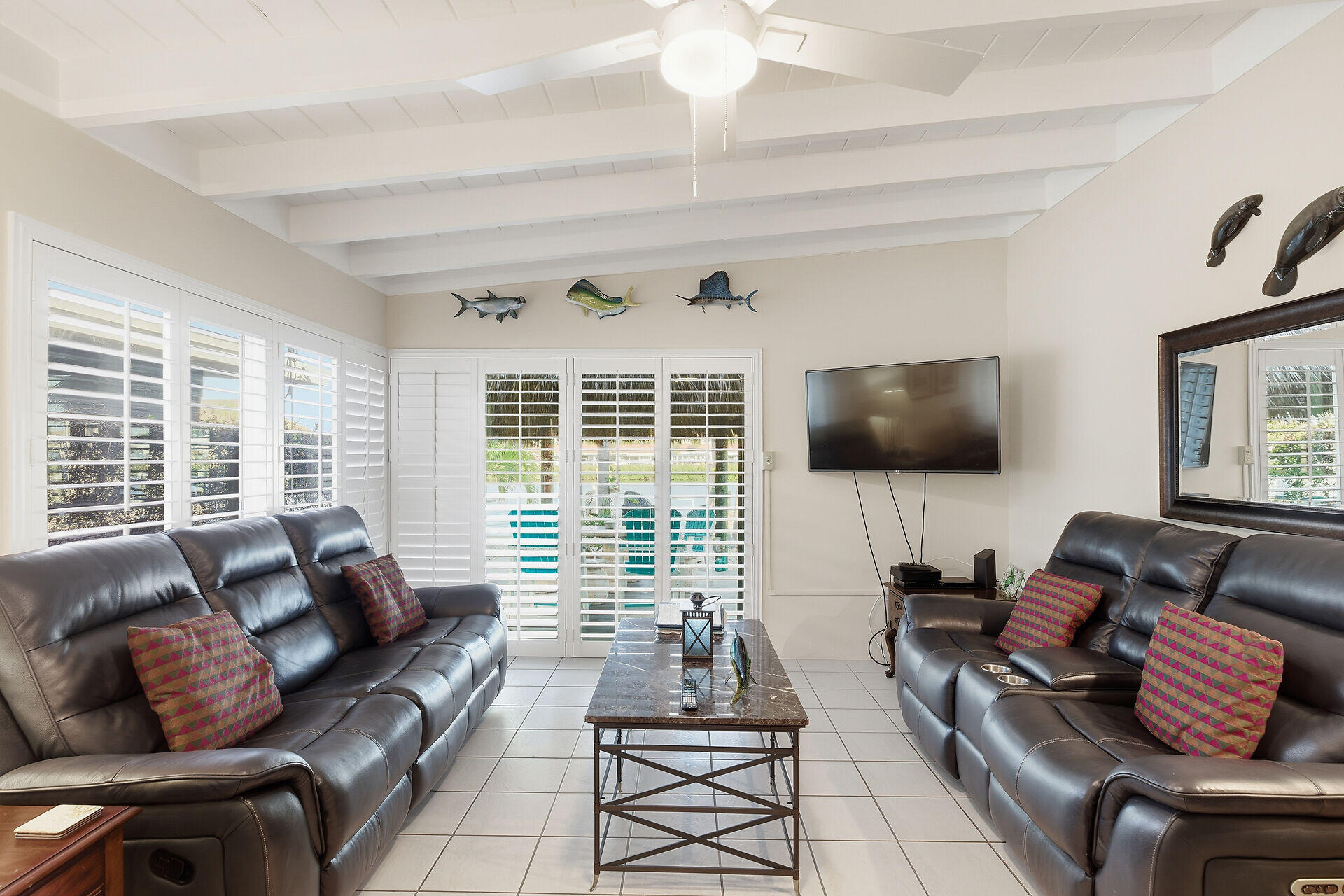 26 7th Street Key Colony Beach, FL 33051 - Photo 10 of 37 a living room with furniture and a flat screen tv