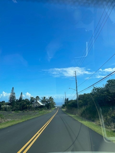 3 Amepela Road Naalehu, HI 96772 - Photo 6 of 6 a view of a golf course with a lake
