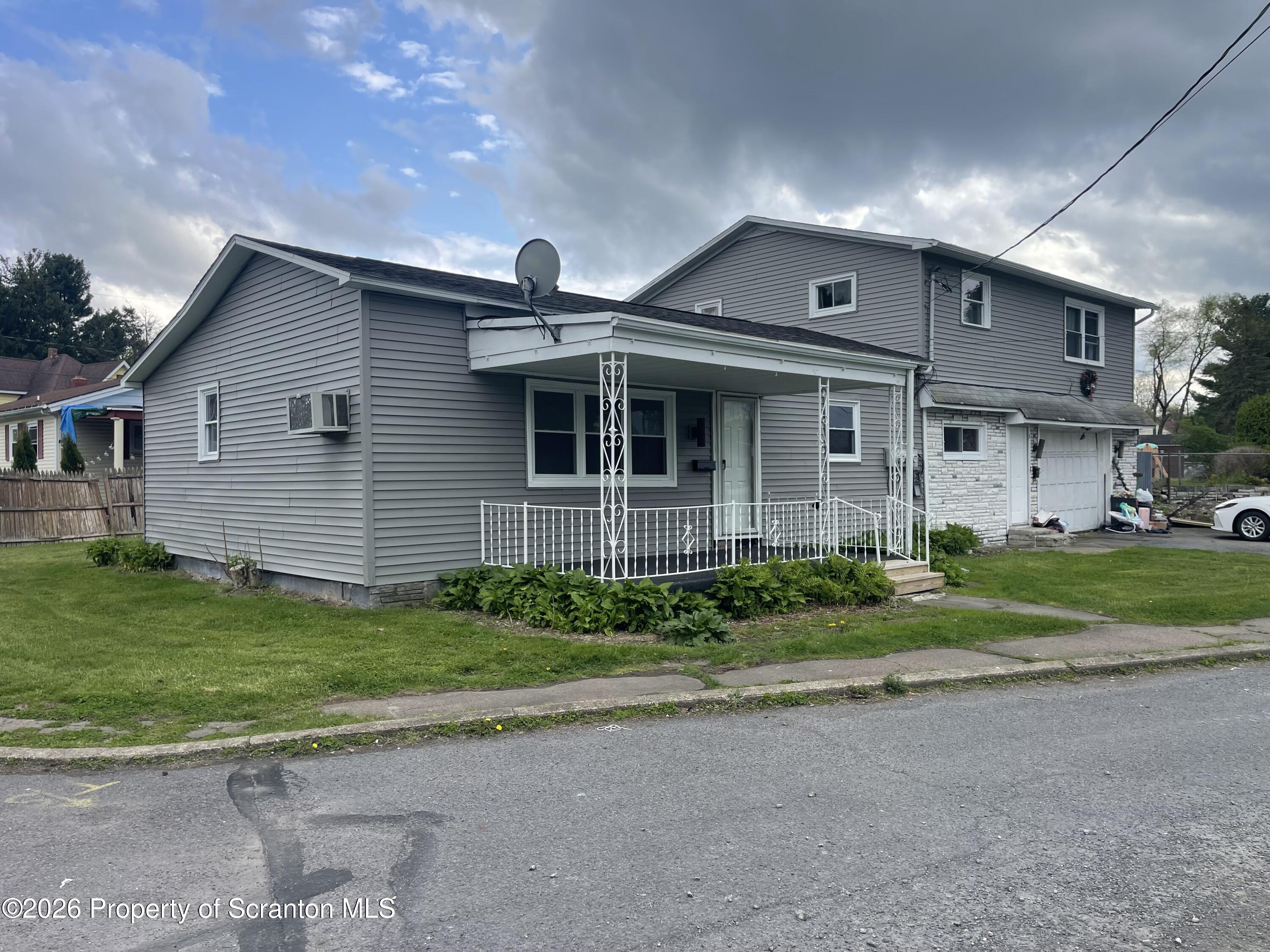 238 George Street Moosic, PA 18507 - Photo 1 of 23 a front view of a house with a yard