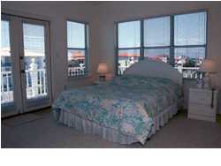 4952 Hwy C30a Santa Rosa Beach Santa Rosa Beach, FL 32459 - Photo 4 of 12 a living room filled with furniture and a floor to ceiling window