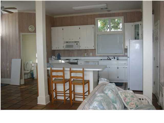 4952 Hwy C30a Santa Rosa Beach Santa Rosa Beach, FL 32459 - Photo 9 of 12 a bathroom with a sink a mirror and a shower