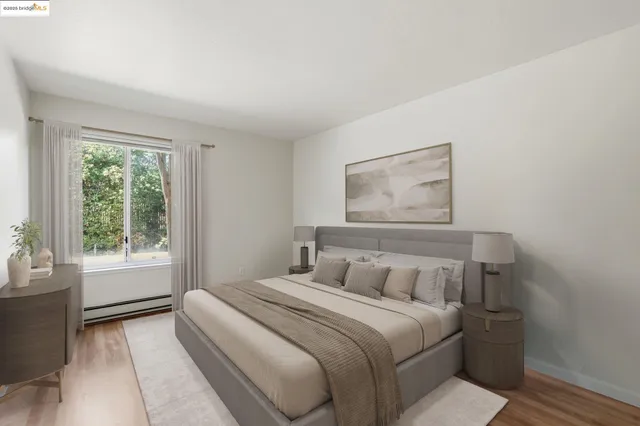 a kitchen with a sink cabinets and wooden floor
