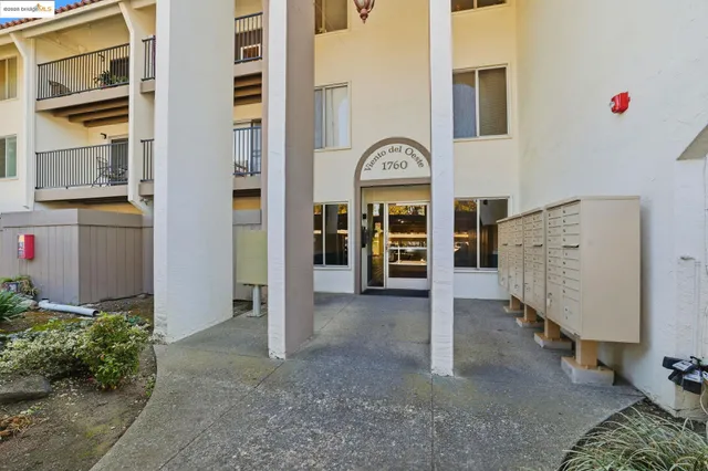 a living room with furniture and white walls