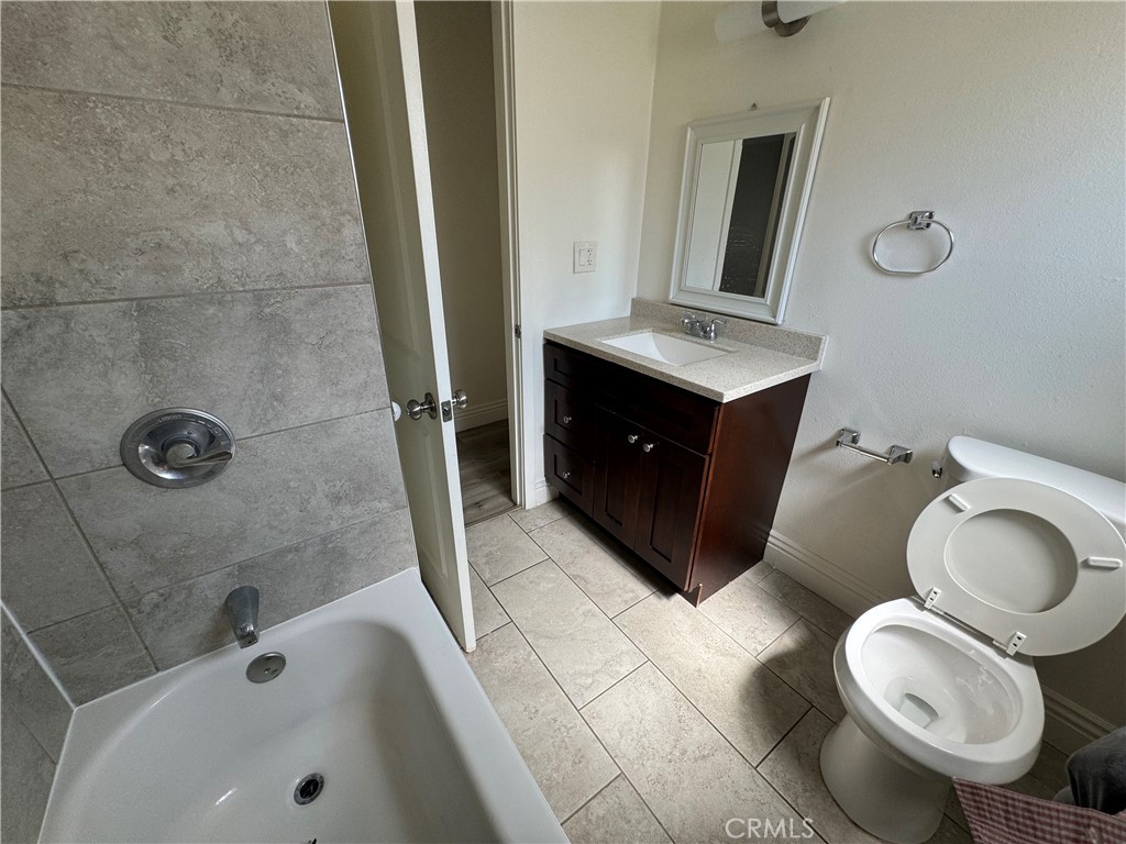 3100 Garnet Lane Fullerton, CA 92831 - Photo 14 of 14 a bathroom with a sink a toilet and bathtub
