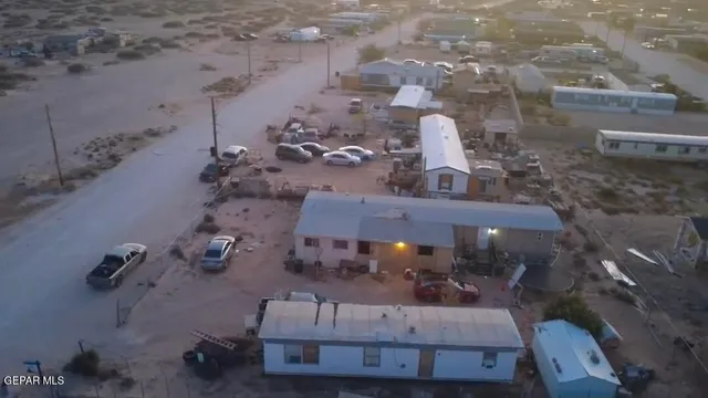 an aerial view of a backyard with seating space