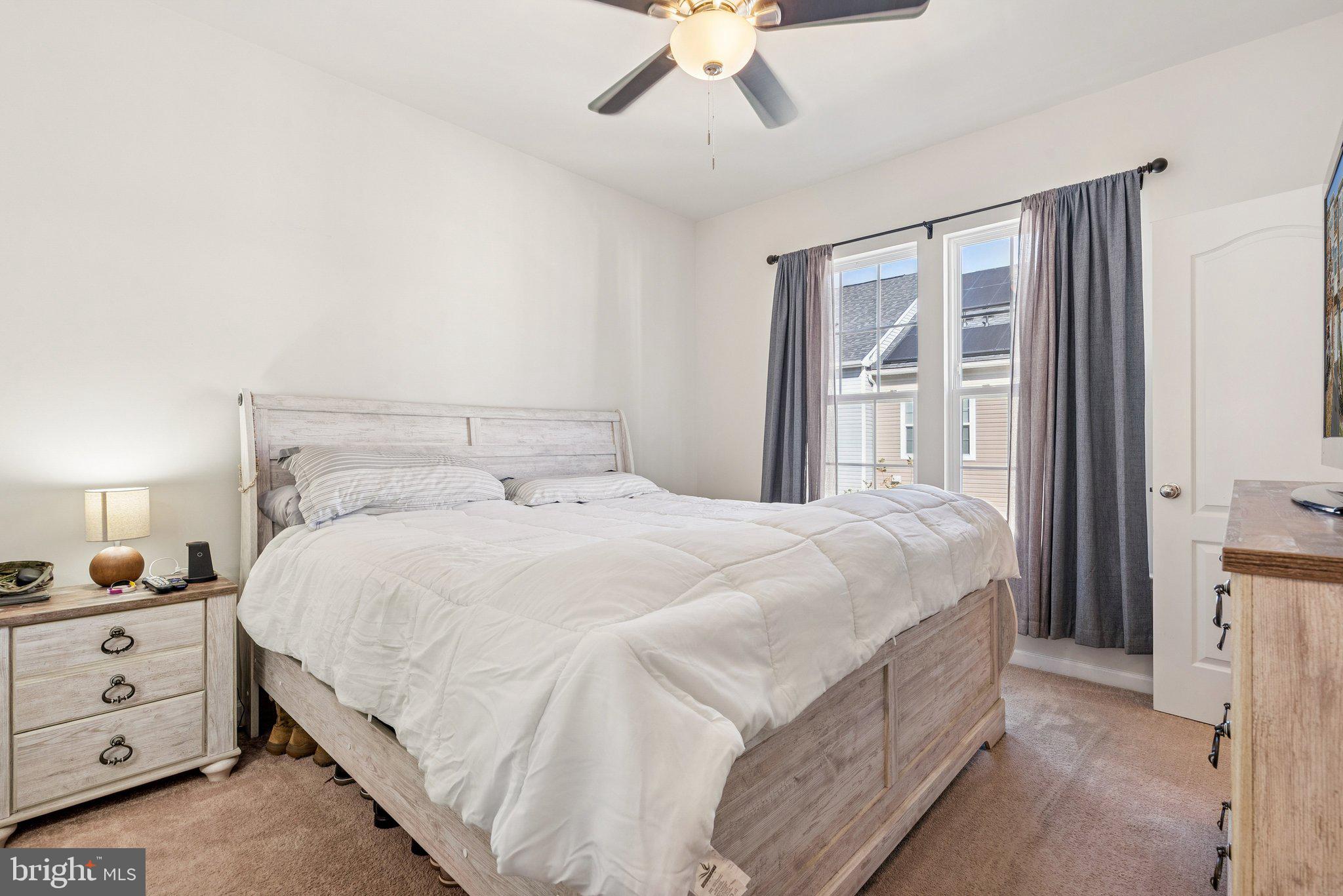 2616 Hardaway Circle Hanover, MD 21076 - Photo 14 of 21 a bedroom with a bed and a chandelier fan