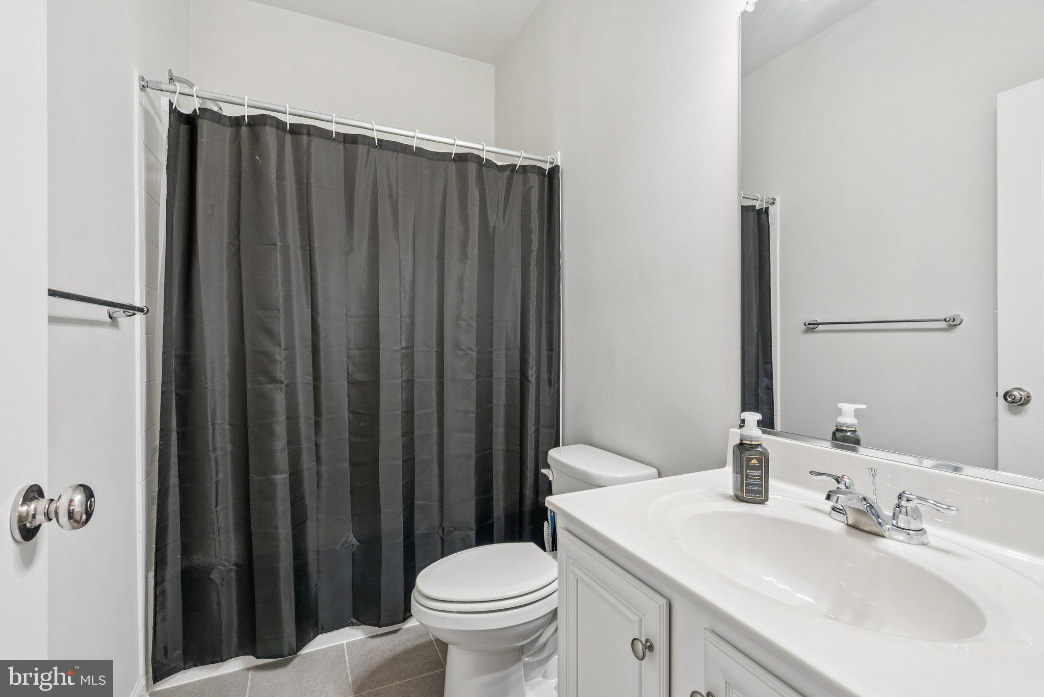 2616 Hardaway Circle Hanover, MD 21076 - Photo 18 of 21 a bathroom with a sink toilet and shower