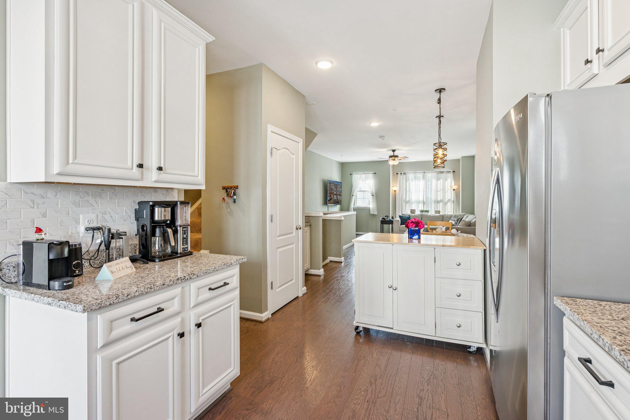 2616 Hardaway Circle Hanover, MD 21076 - Photo 6 of 21 a kitchen with white cabinets and stainless steel appliances