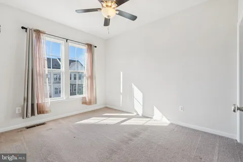 a bathroom with a sink a toilet and shower curtain