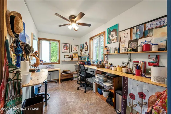 a room with furniture a rug and a window