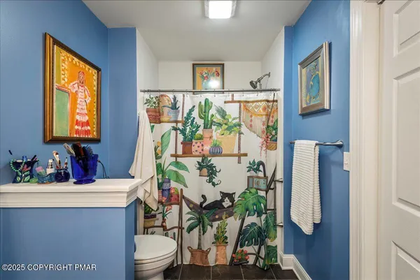 a bathroom with a sink toilet and mirror