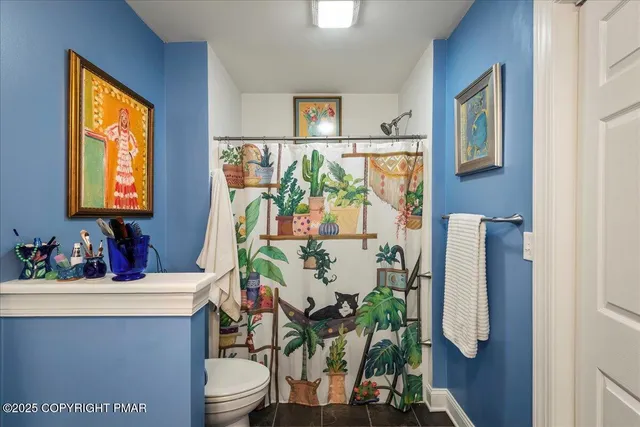 a bathroom with a sink toilet and mirror