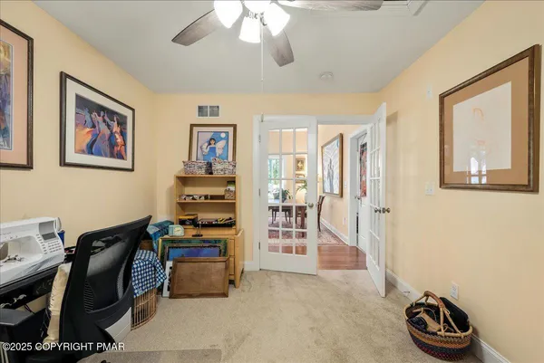 a view of a workspace with furniture