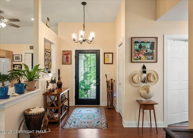 a view of a room with furniture and wooden floor