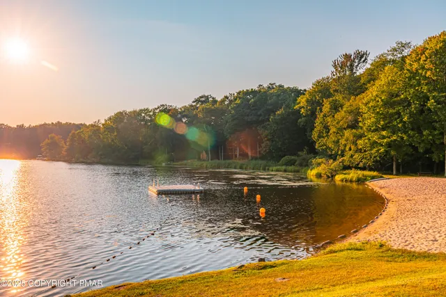a view of a swimming pool with a yard