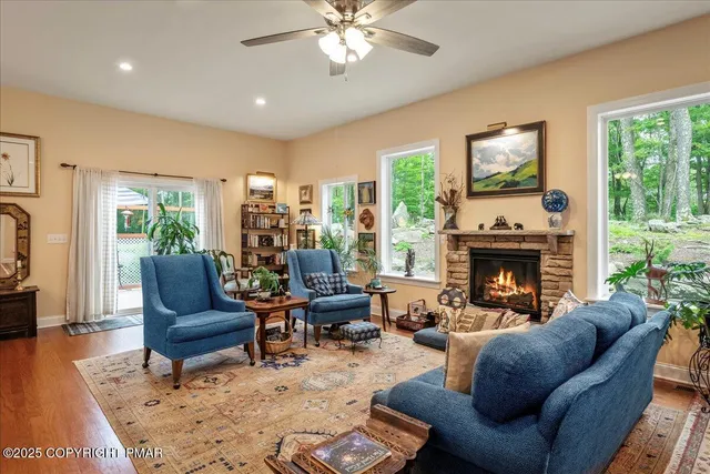 a living room with furniture and a fireplace