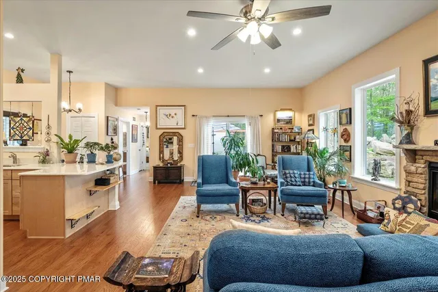 a living room with furniture and a large window