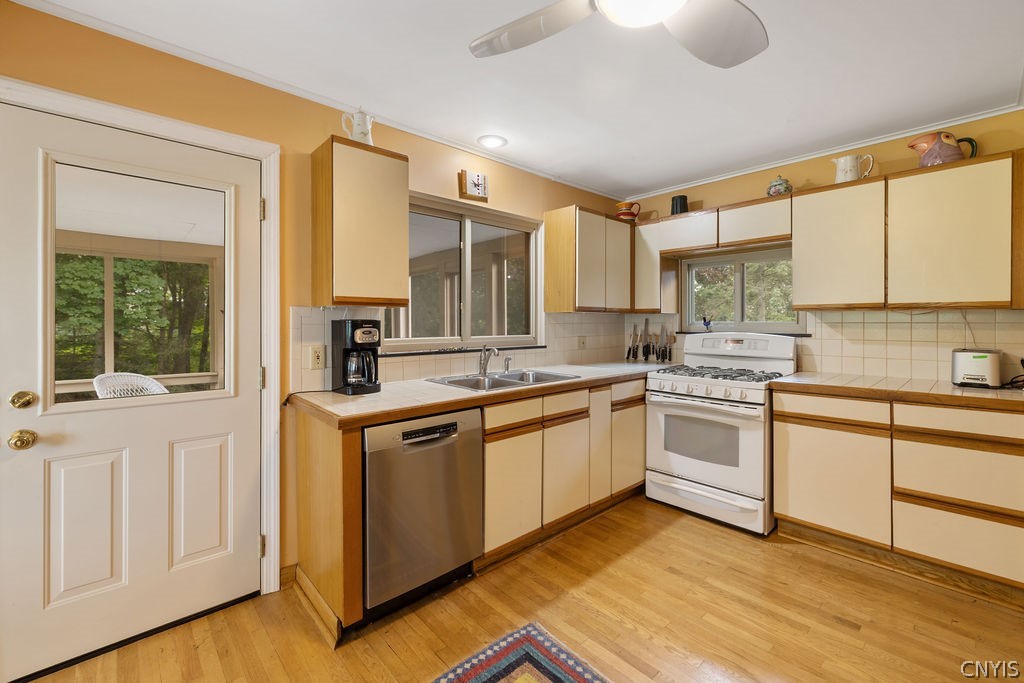 108 Archer Road Syracuse, NY 13207 - Photo 16 of 44 Large Kitchen and door to screened in porch and deck