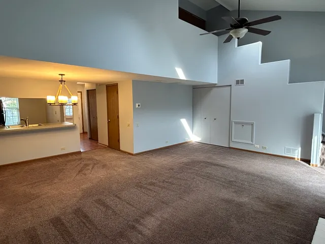 a view of a hallway with a kitchen