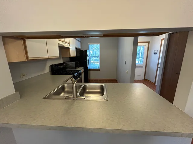 a view of a kitchen with a sink