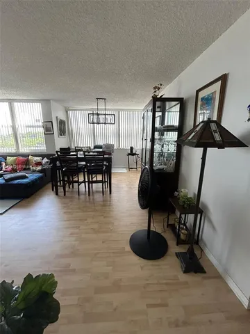 a large kitchen with stainless steel appliances granite countertop a stove a sink dishwasher and a refrigerator