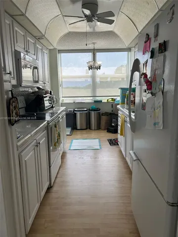 a bedroom with a bed and a chair