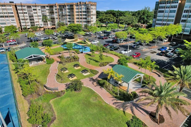 an aerial view of a golf course with a swimming pool