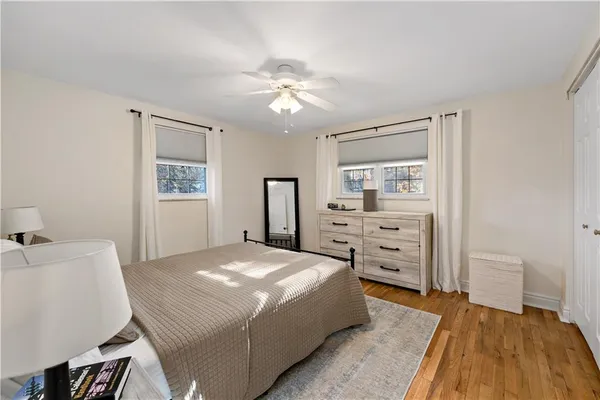 a bedroom with a bed and a table