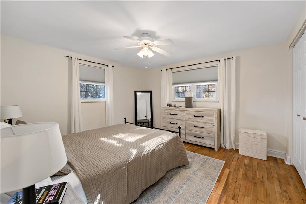 203 Washington Road Pittsburgh, PA 15221 - Photo 19 of 36 a bedroom with a bed and a table