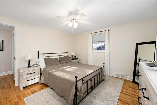 a bed room with a bed and a chandelier
