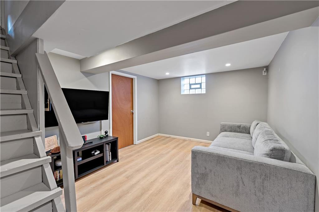 203 Washington Road Pittsburgh, PA 15221 - Photo 26 of 36 a bedroom with a bed and flat screen tv