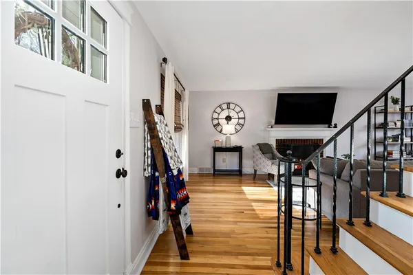 a view of entryway livingroom and hall
