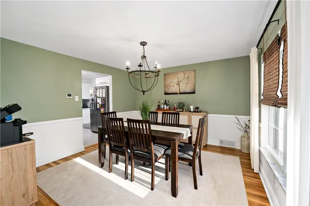 a view of a dining room with furniture and window