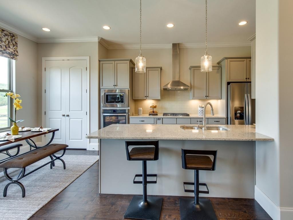 53 Saddle Ridge Mount Mount Juliet, TN 37122 - Photo 13 of 23 a kitchen with stainless steel appliances kitchen island a refrigerator and a stove