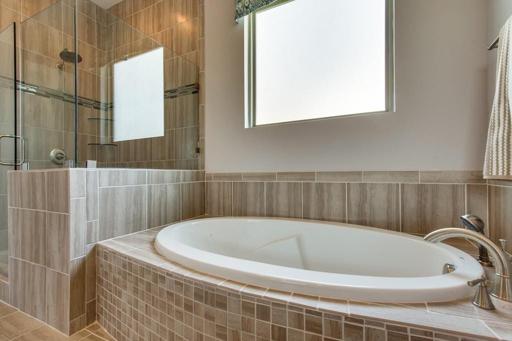 53 Saddle Ridge Mount Mount Juliet, TN 37122 - Photo 17 of 23 a bath tub sitting in a bathroom next to a window